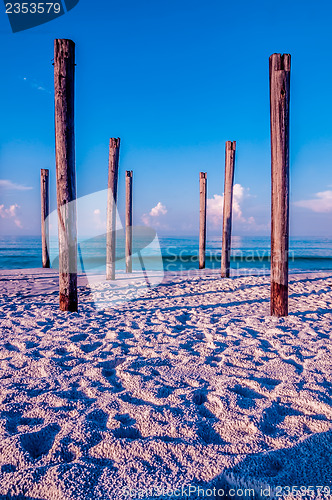 Image of old sea pier ruins on the beach