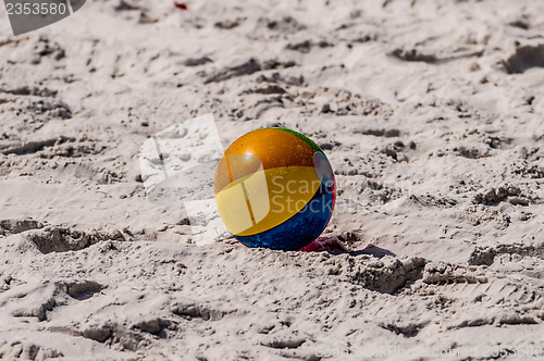 Image of   beach and beach ball on the sand.