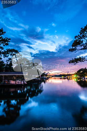 Image of A Very Colorful Mythical Sunset Over water way near ocean