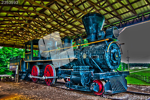 Image of An old steam locomotive in a garage 