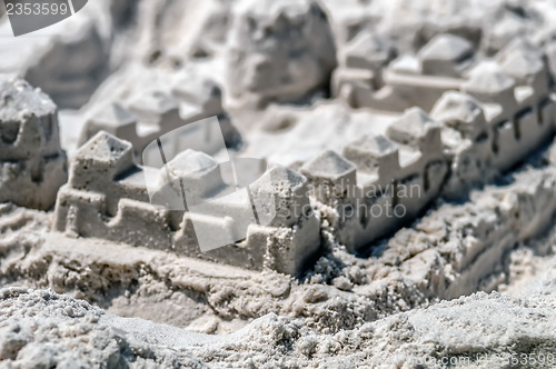 Image of sand castle structures built at seashore