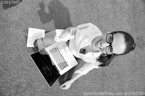 Image of woman with laptop in park