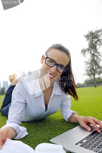 Image of woman with laptop in park