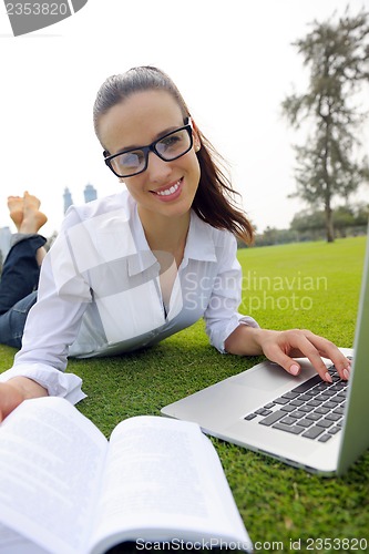 Image of woman with laptop in park