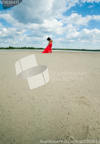 Image of Attractive naked girl on river bank