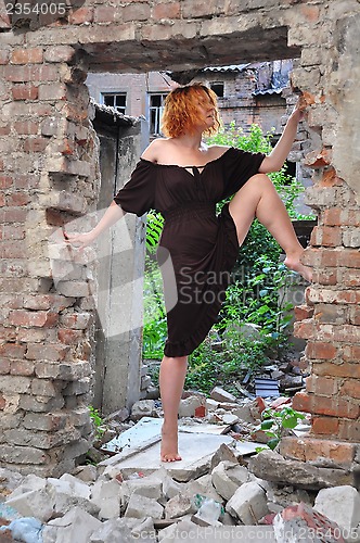 Image of grunge portrait of a  woman in urban ruins