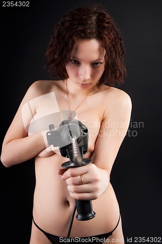 Image of topless woman body with puncher