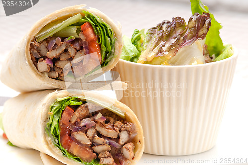 Image of kafta shawarma chicken pita wrap roll sandwich