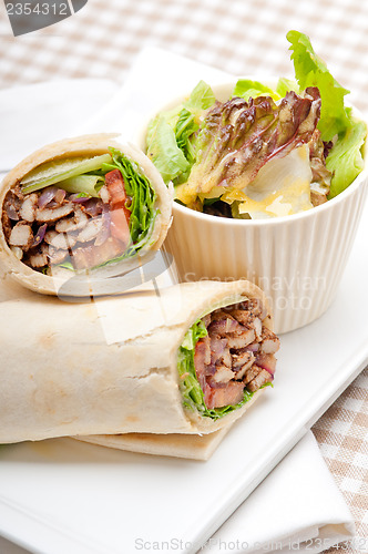 Image of kafta shawarma chicken pita wrap roll sandwich