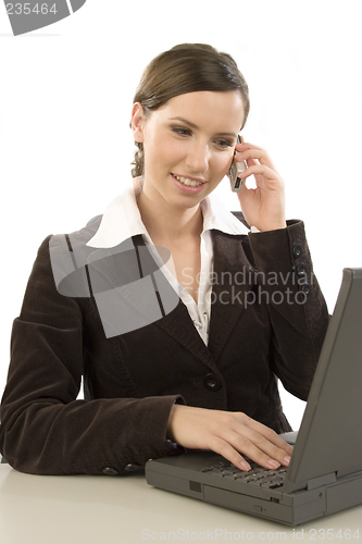 Image of Working with cell phone and laptop