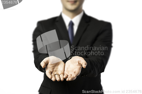 Image of Businessman stretching out both hands