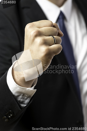 Image of Businessman holding up his fist