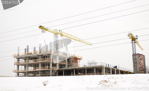 Image of building construction industry cranes winter snow 