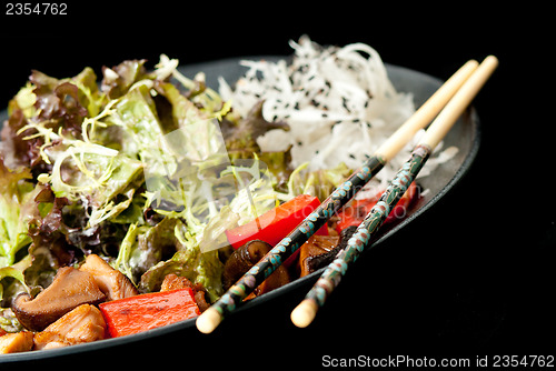 Image of Healthy Japanese salad on the black plate