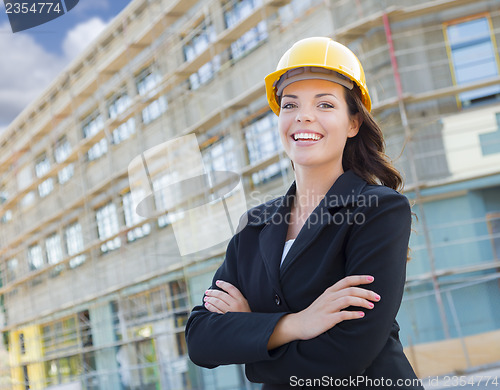 Image of Portrait of Female Contractor Wearing Hard Hat at Construction S