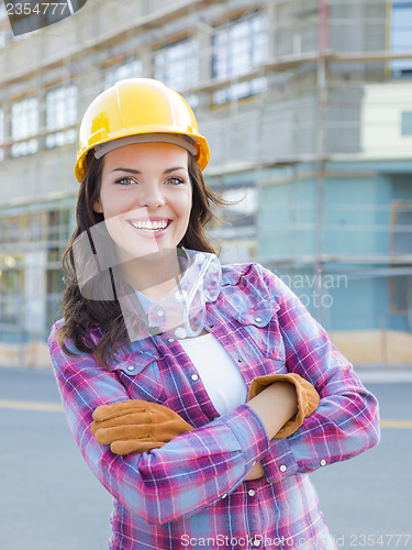 Image of Young Attractive Female Construction Worker Wearing Hard Hat and