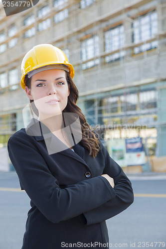 Image of Portrait of Female Contractor Wearing Hard Hat at Construction S