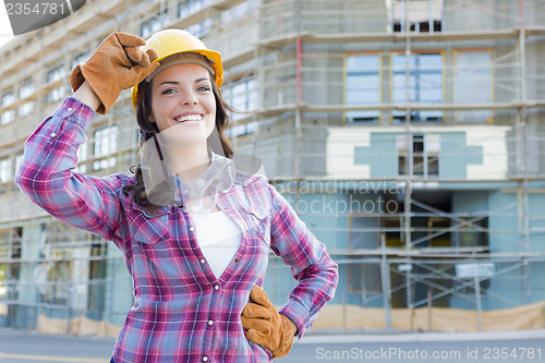 Image of Young Attractive Female Construction Worker Wearing Hard Hat and