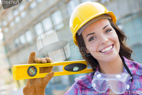 Image of Young Attractive Female Construction Worker Wearing Hard Hat and