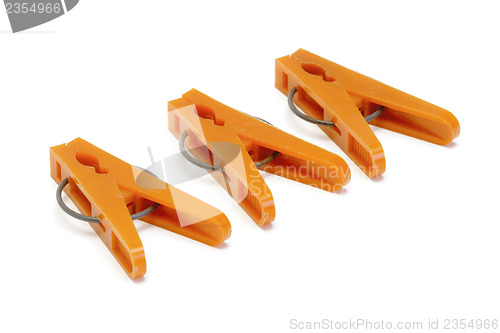 Image of Orange plastic clothespins