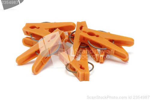 Image of Orange plastic clothespins