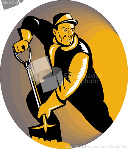 Image of coal miner worker with shovel digging