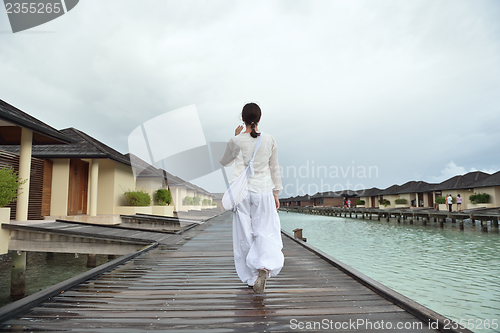 Image of young woman relax on cloudy summer day