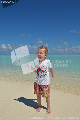 Image of happy young kid on beach