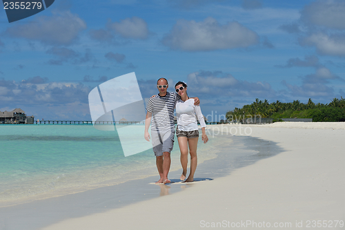 Image of happy young  couple at summer vacation have fun and relax at bea