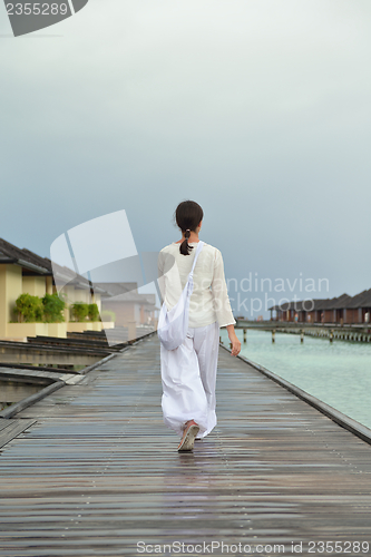 Image of young woman relax on cloudy summer day