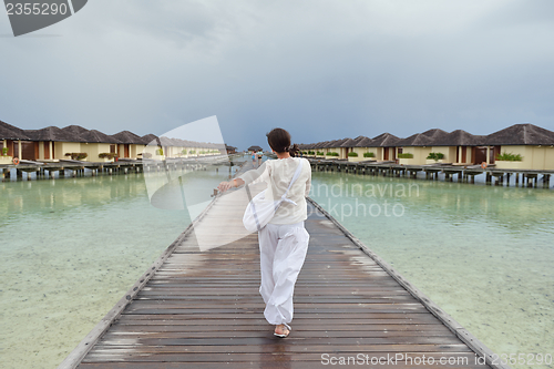 Image of young woman relax on cloudy summer day