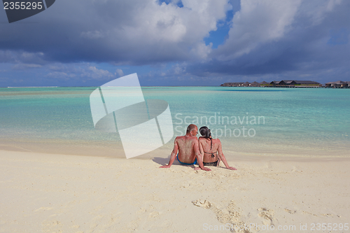 Image of happy young  couple at summer vacation have fun and relax at bea