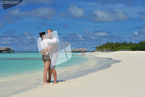 Image of happy young  couple at summer vacation have fun and relax at bea