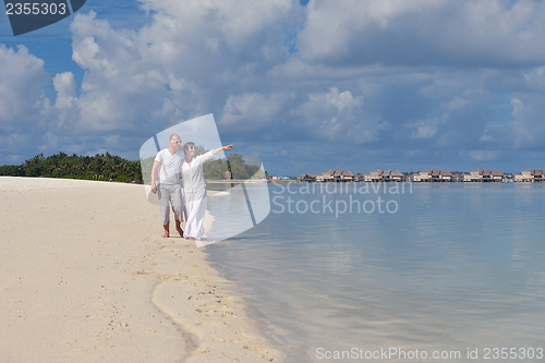 Image of happy young  couple at summer vacation have fun and relax at bea