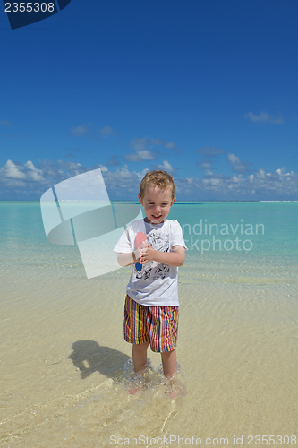 Image of happy young kid on beach