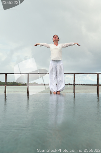 Image of young woman relax on cloudy summer day