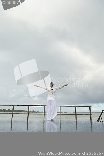 Image of young woman relax on cloudy summer day