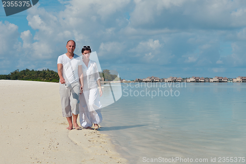 Image of happy young  couple at summer vacation have fun and relax at bea