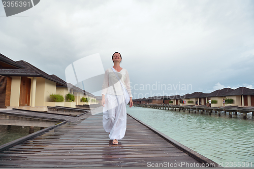 Image of young woman relax on cloudy summer day