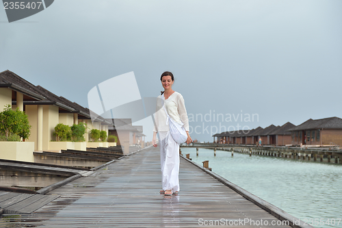 Image of young woman relax on cloudy summer day