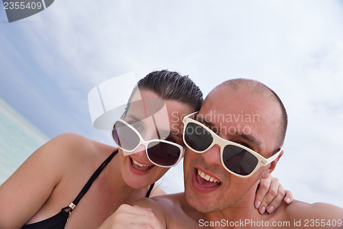 Image of happy young  couple at summer vacation have fun and relax at bea