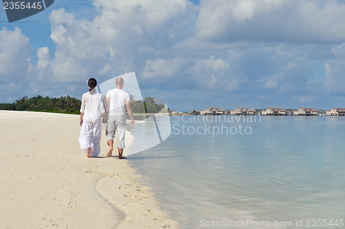 Image of happy young  couple at summer vacation have fun and relax at bea