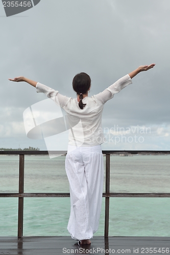 Image of young woman relax on cloudy summer day