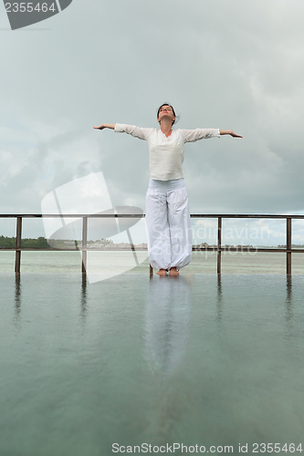 Image of young woman relax on cloudy summer day