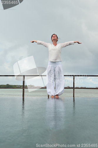 Image of young woman relax on cloudy summer day