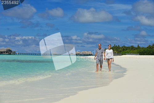 Image of happy young  couple at summer vacation have fun and relax at bea