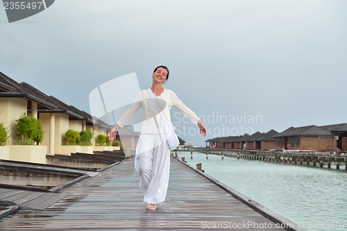 Image of young woman relax on cloudy summer day