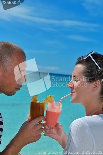 Image of happy young couple relax and take fresh drink