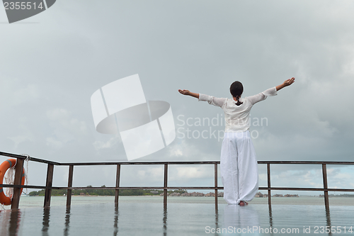 Image of young woman relax on cloudy summer day