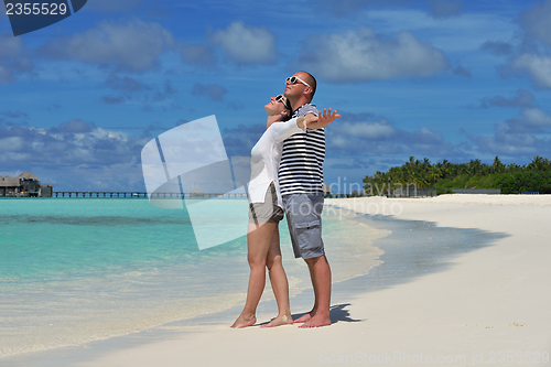 Image of happy young  couple at summer vacation have fun and relax at bea